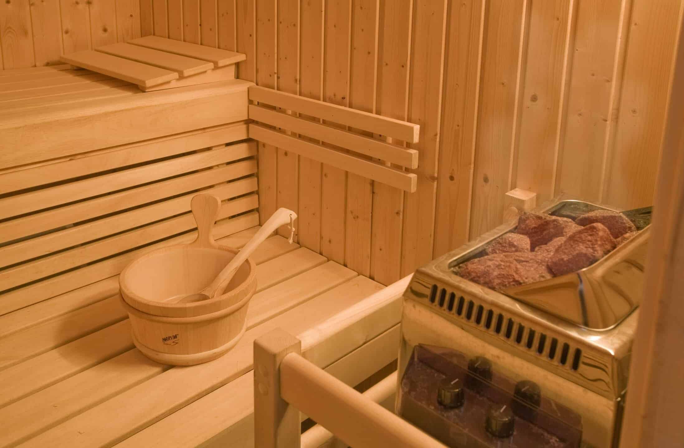 Sauna with water bucket and coals