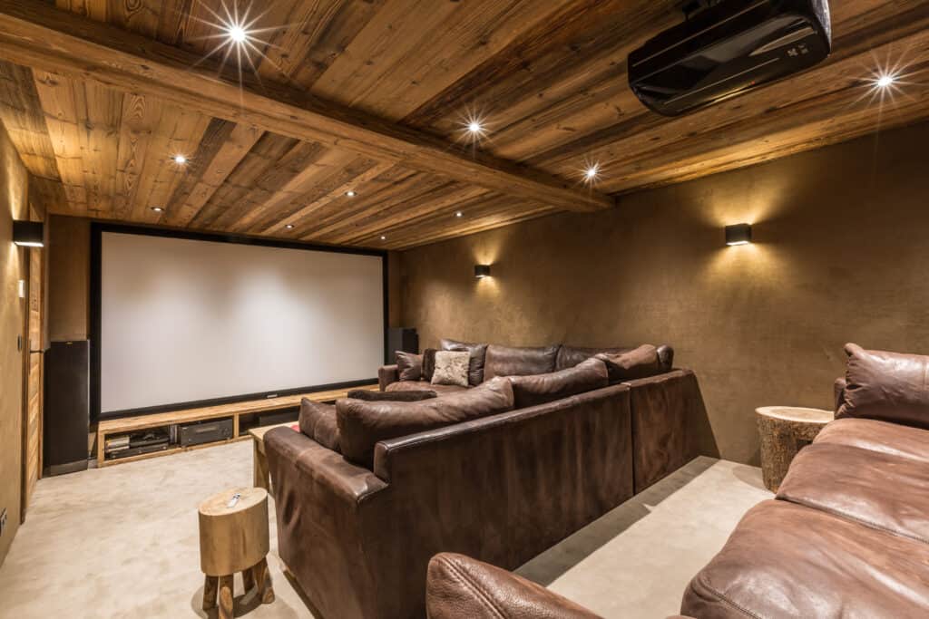 Large home cinema with brown leather sofas