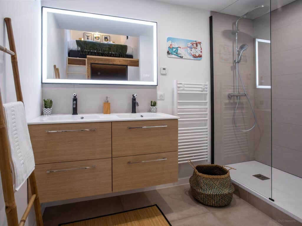One of the modern bathrooms at LoftYaute with a double basin and Italian shower
