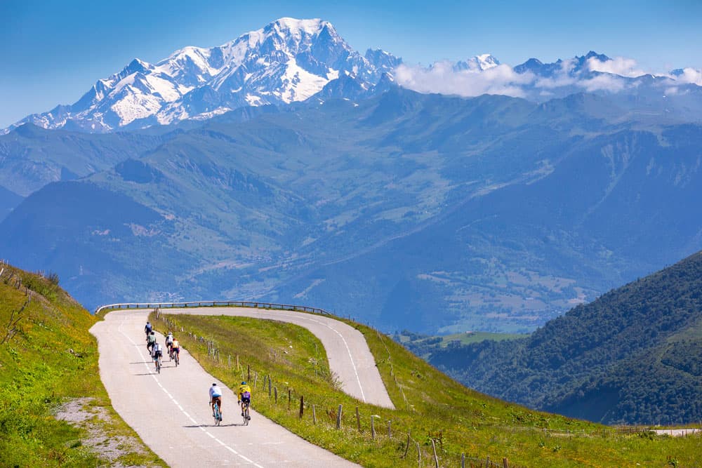 Cyclists head for a hairpin bend in the mountains