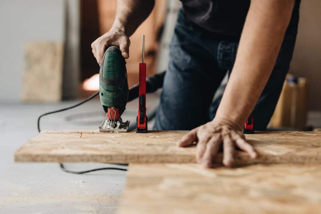 Hands operate power tools