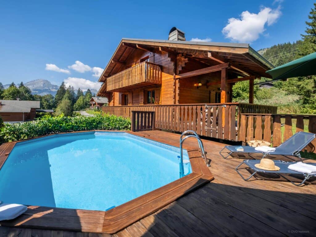 Traditional wooden chalet with outdoor pool