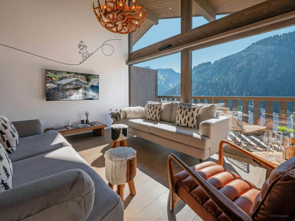 Alpine living room with large windows overlooking windows