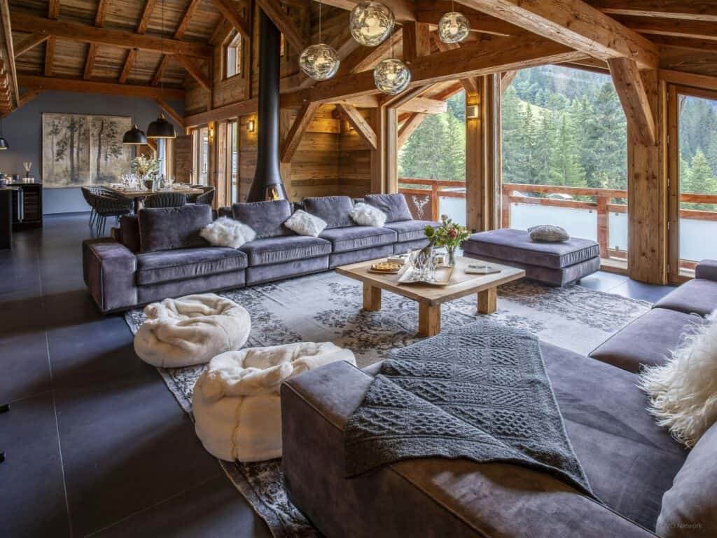 Summer chalet with large windows overlooking the mountains