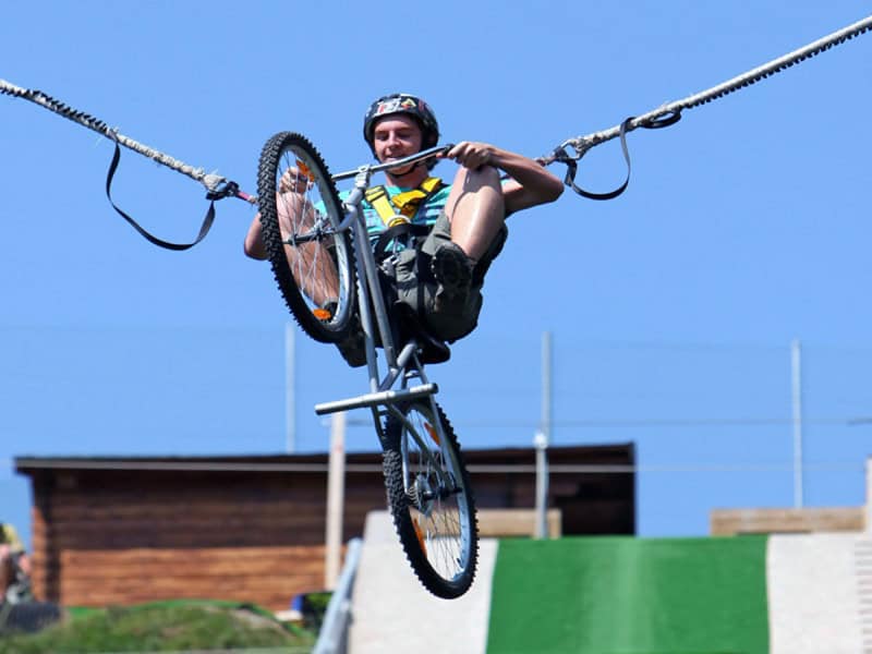 A man rides the Bun J on a bike