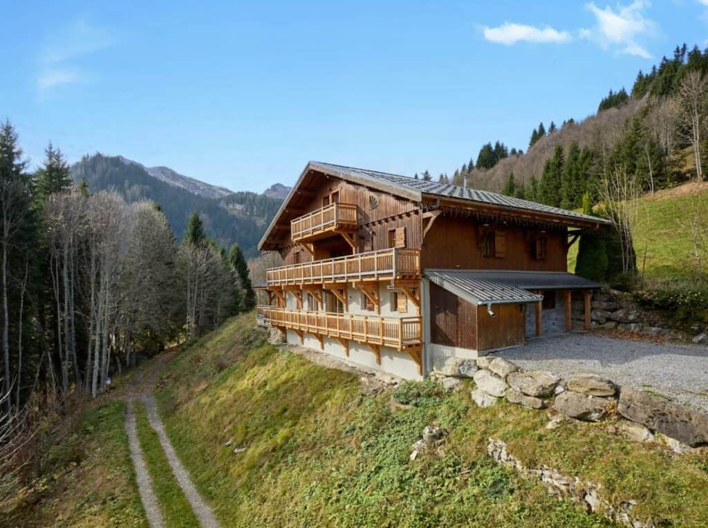 The outside of Chalet Les Pellys, in Samoëns, in the summer.